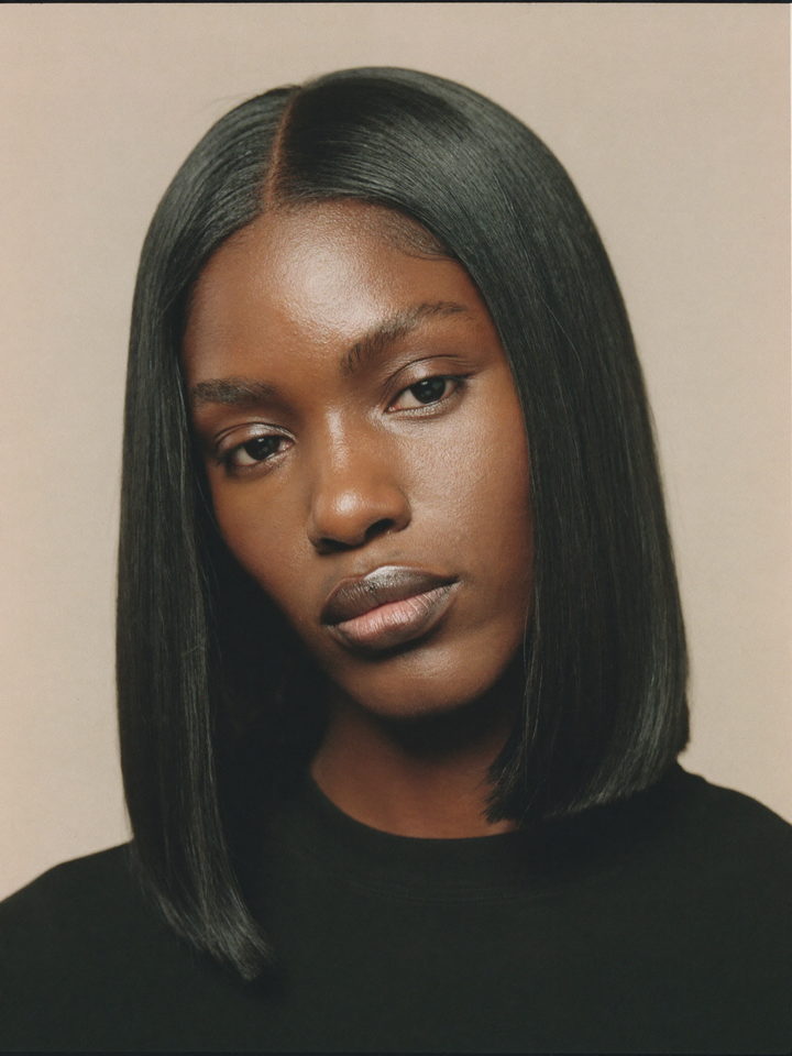 Model wearing a glueless straight unit with the hairline blended in