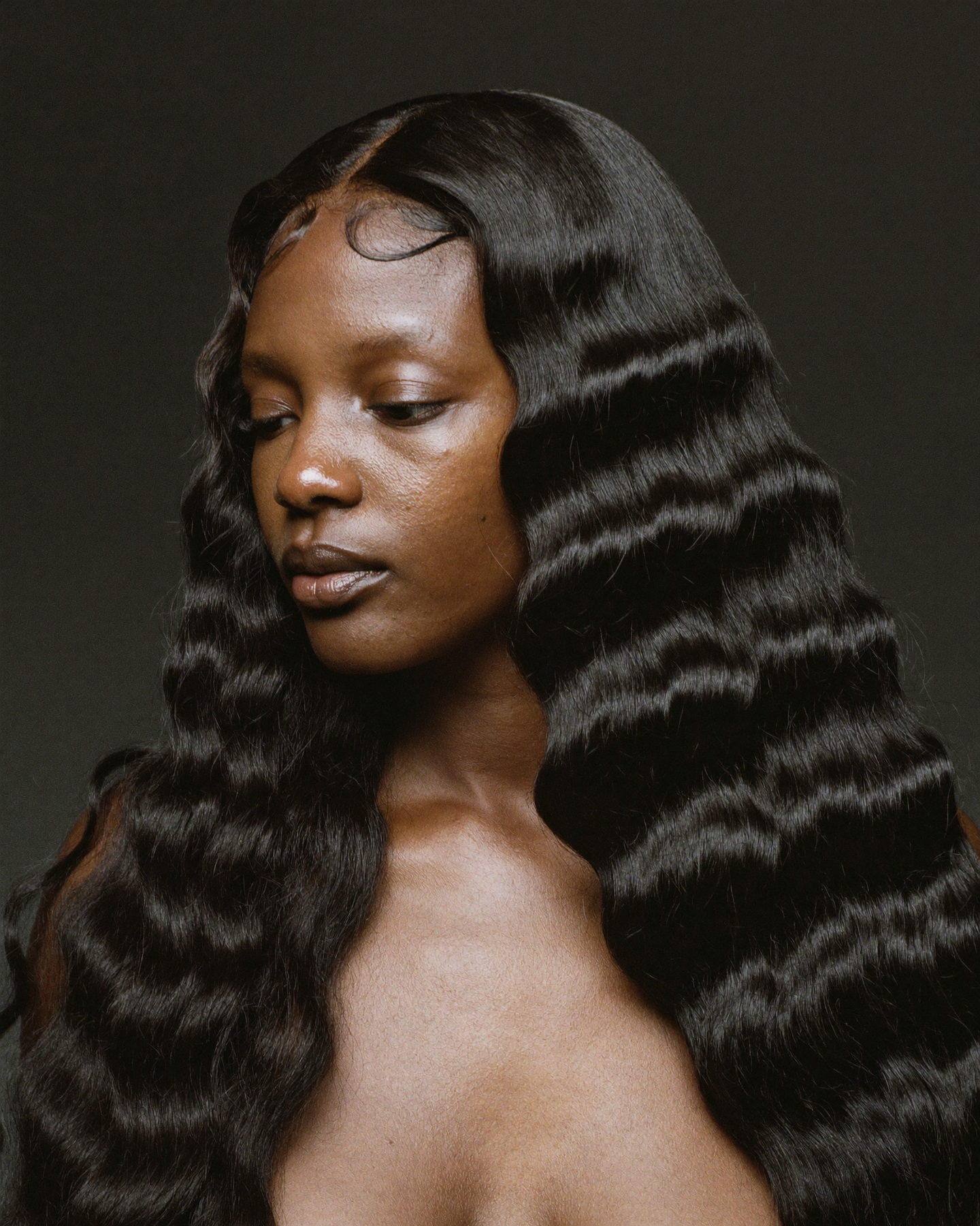 Close portrait of a glueless HD lace front unit, lace hairline blended in