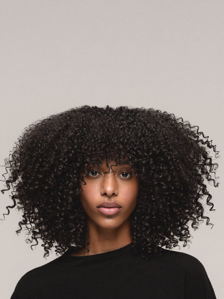 360 lace unit, curly, shown on a model