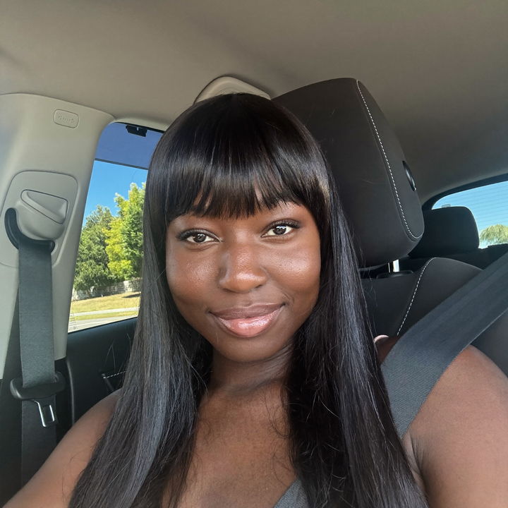 Customer in a parked car wearing a straight glueless bob