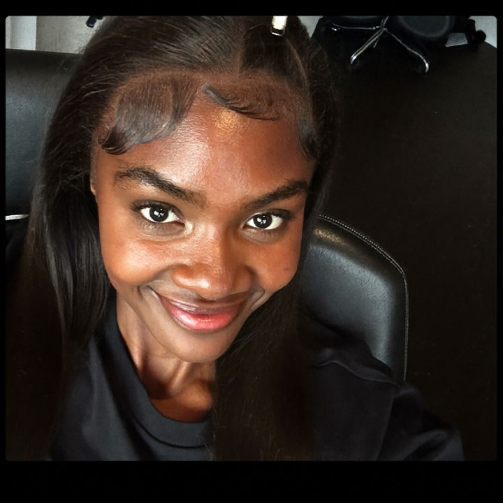Customer at the salon after an install, edges laid